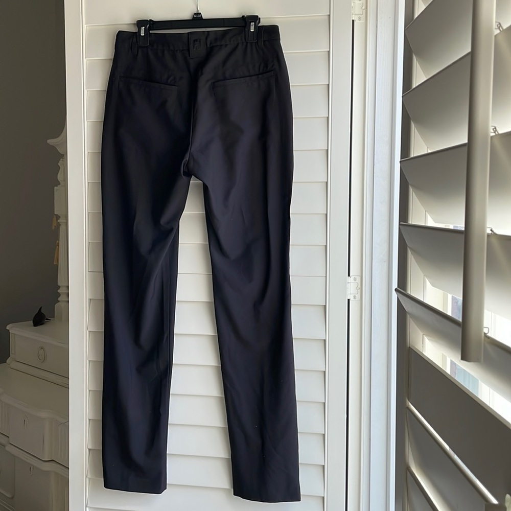 Footjoy mens pants with flat front and rear and side pockets in black. 32x34